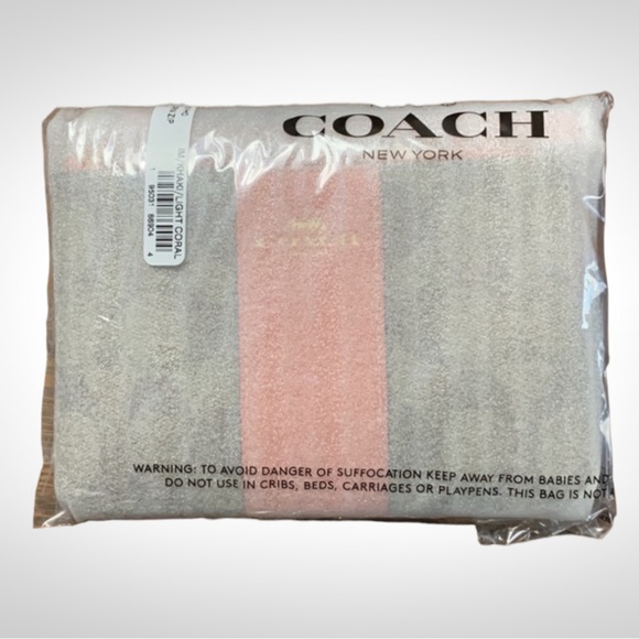 Coach Corner Zip Wristlet in Signature
Canvas Tan with Coral Stripe - Picture 5 of 5